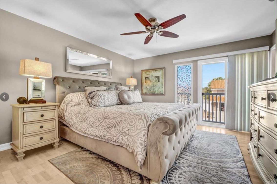 Primary bedroom with tufted bed